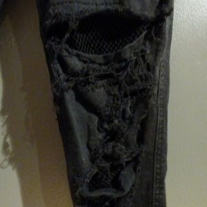 Royal bones fishnet distressed skinnies